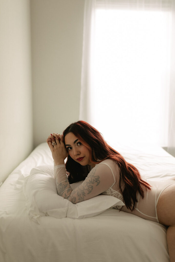 Denver boudoir photographer capturing a confident woman in studio setting